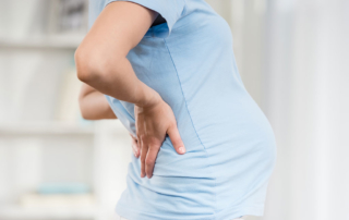 woman with pregnancy back pain in physical therapy in san antonio