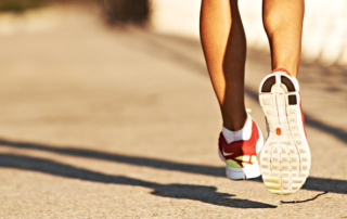 closeup of the back of a woman's legs while she's on a run