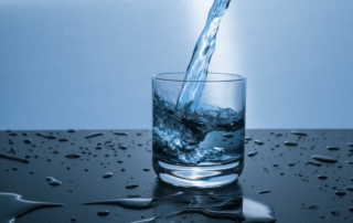 cup being filled with water to drink