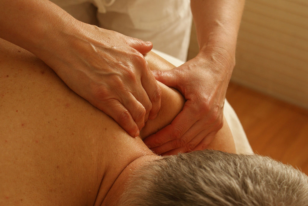 man in chronic pain receiving massage