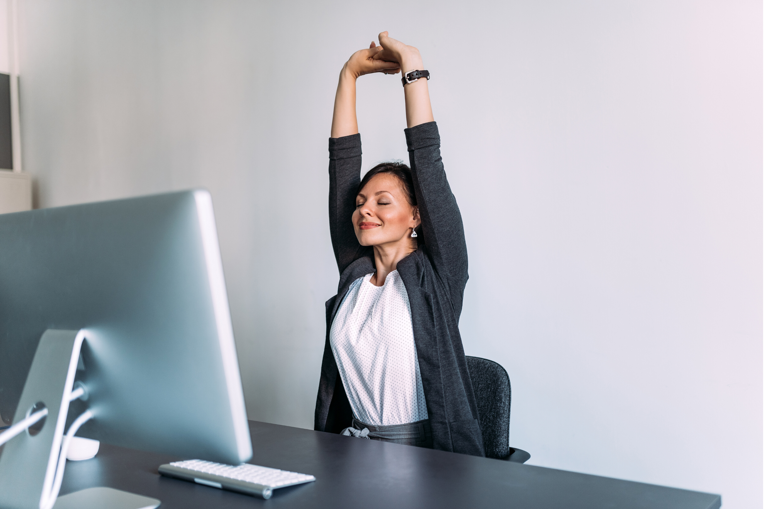 woman stretching before telehealth physical therapy