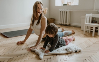 mother and daughter doing an at home workout