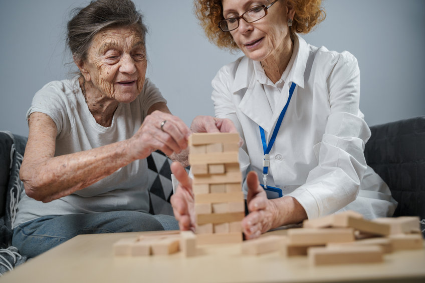 women stacking blocks in occupational therapy