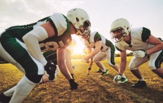 group of football players standing in ready position to play a game
